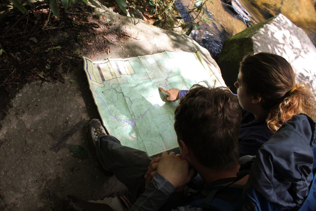 Two Students Looking At A Map